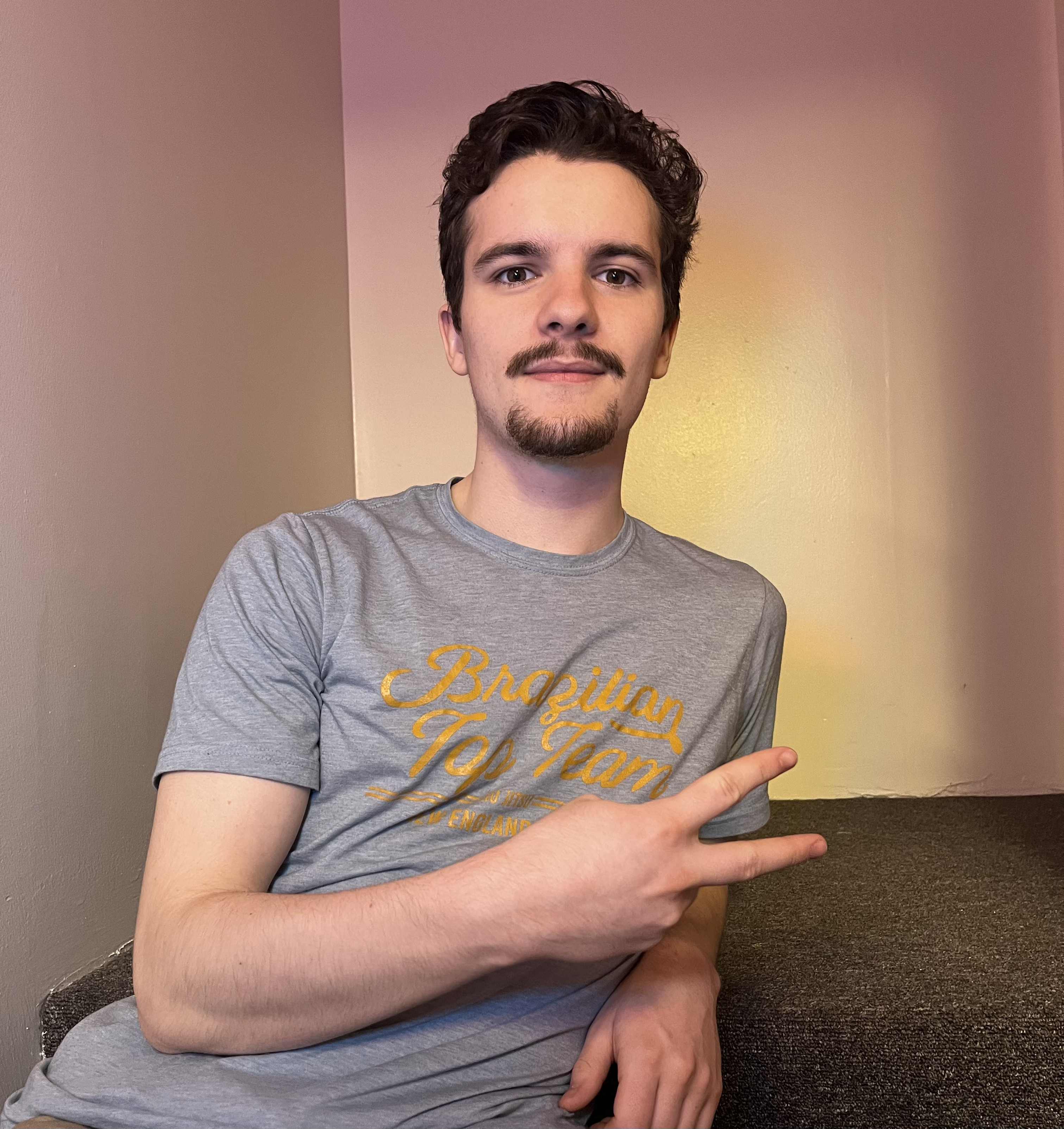 dylaniy posing w/ peace sign